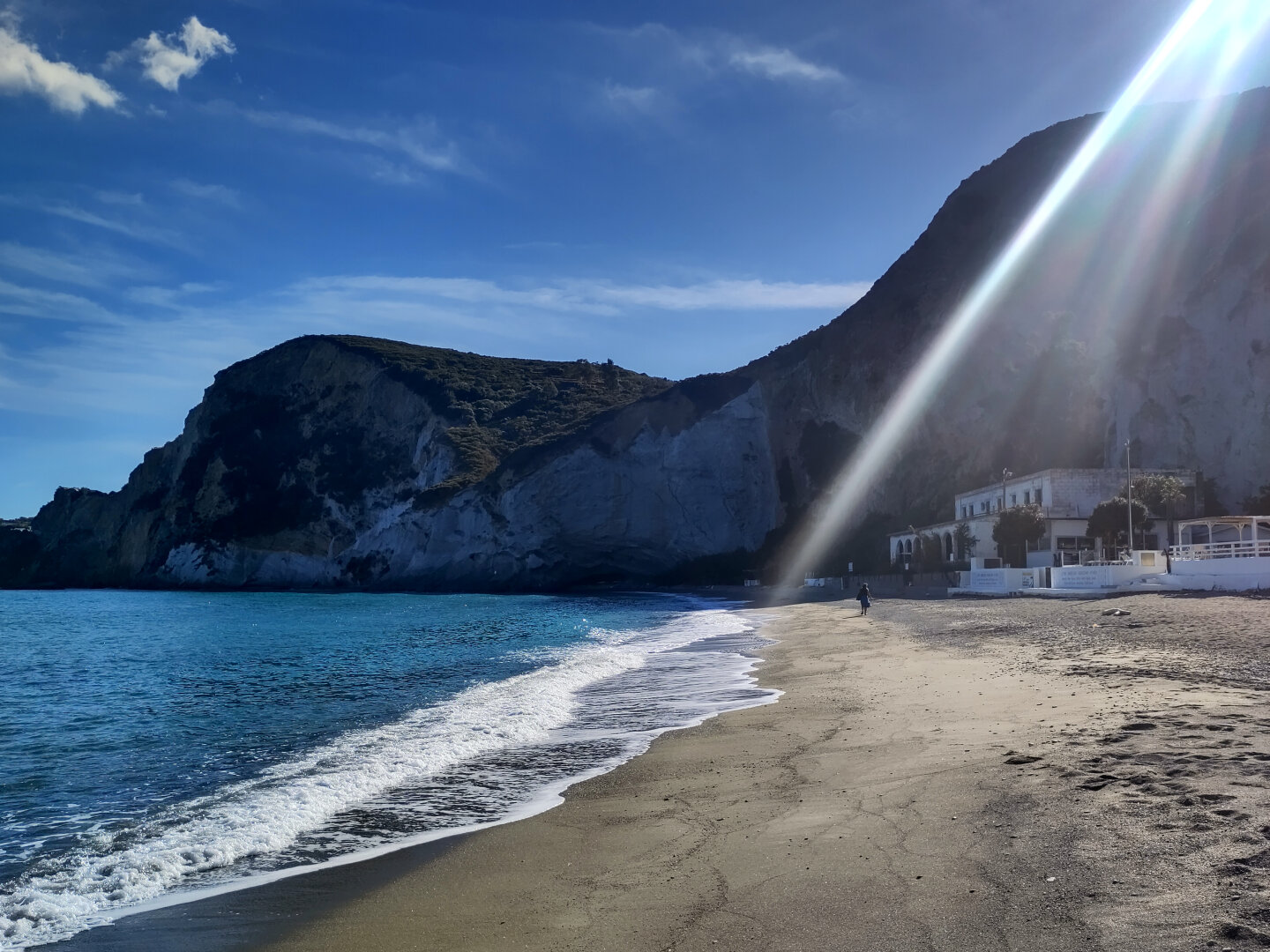 The beach «Frontone« on the island «Ponza» at bright daylight in october with a sun beam from the upper right corner. There are no people on the beach.
